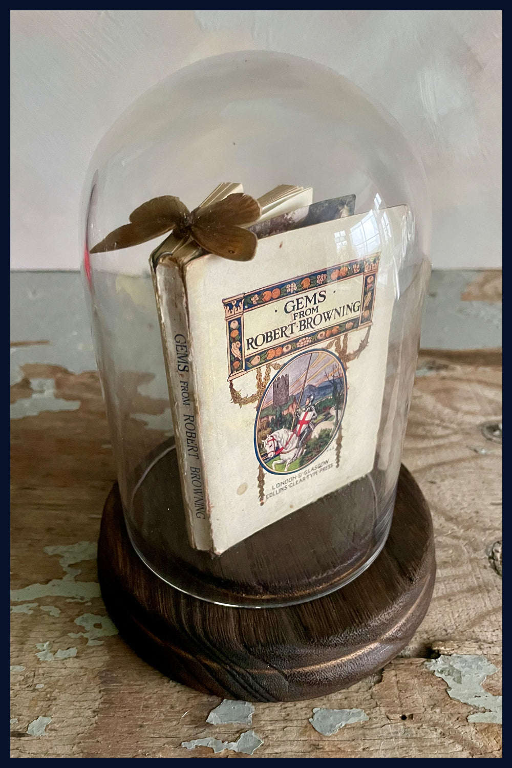 Enigma Variations Collection: Miniature Antique Book 'Gems by Robert Browning' with a Vintage Butterfly in a Display Dome